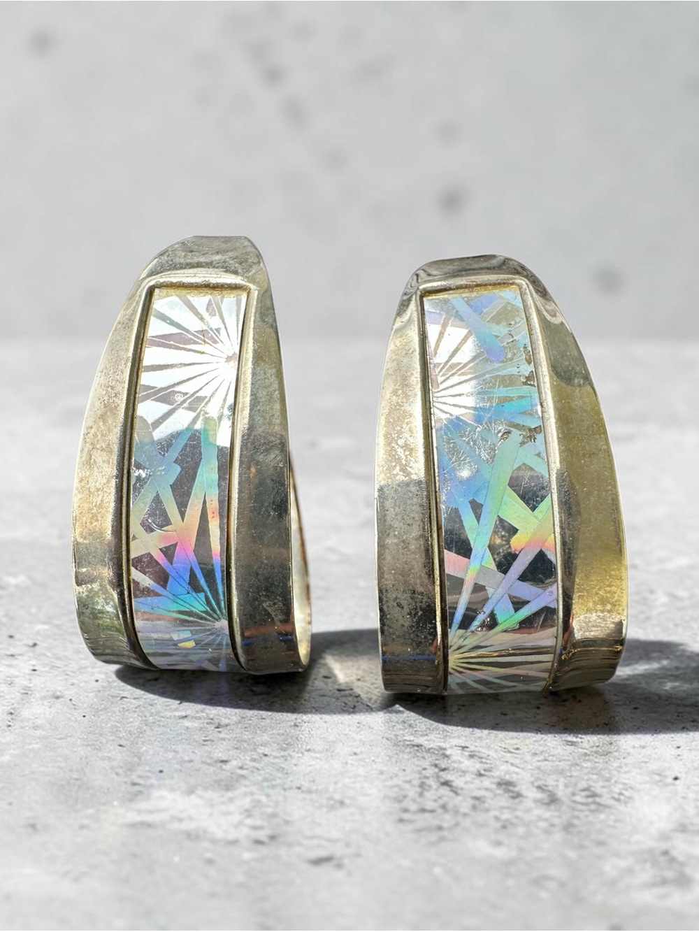 vintage silver-tone hoop earrings with a vibrant geometric holographic or faux-o